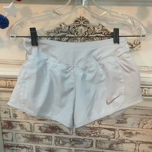 White Nike shorts